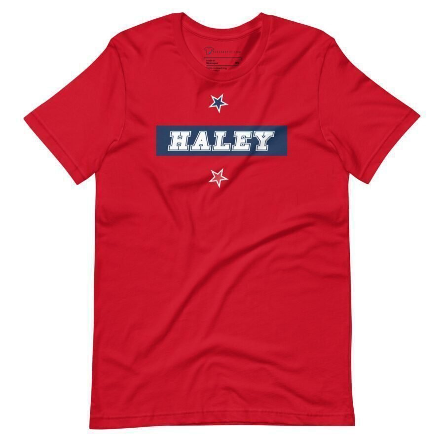 A red Nikki Haley | Elections 2024 | Unisex Heavy Cotton Tee with the word Haley on it, perfect for supporters of Nikki Haley in the 2024 elections.