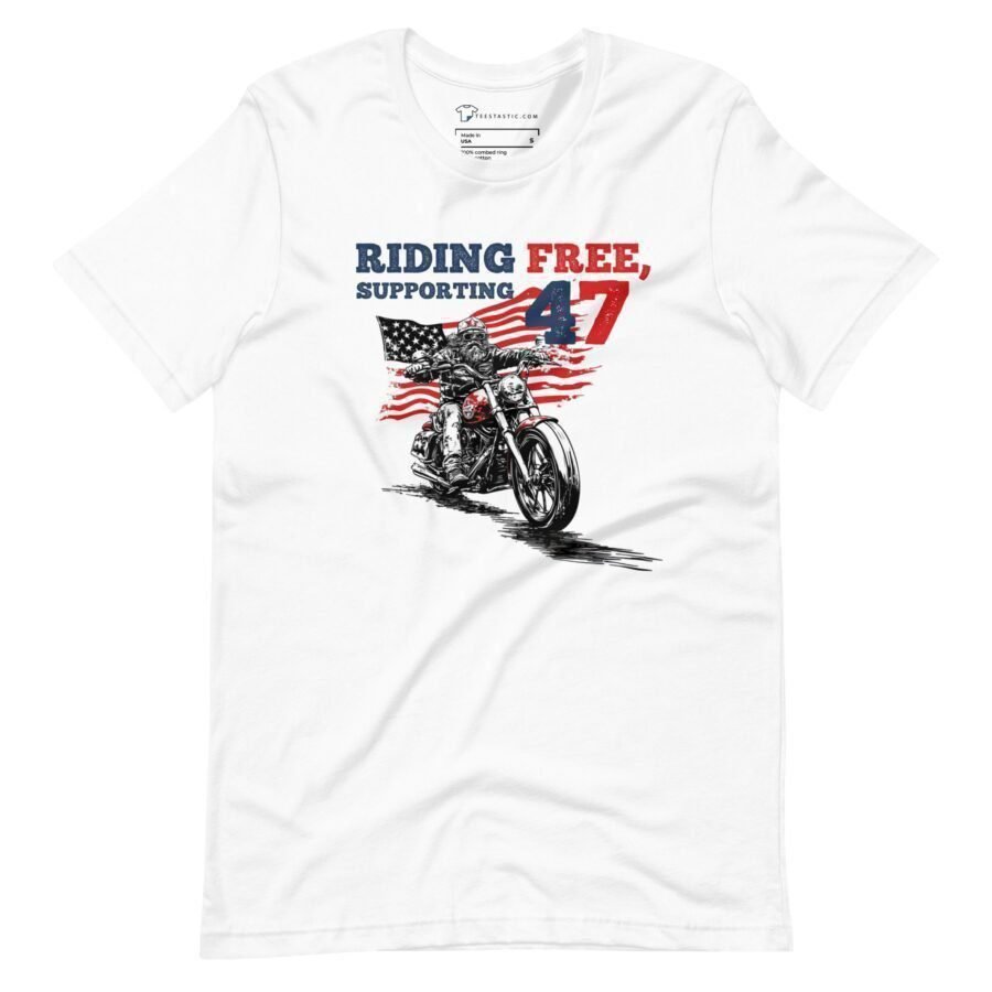 Introducing the "Riding Free | Elections 2024" unisex white T-shirt, featuring a motorcycle design, American flag, and the text "Riding Free, Supporting 47". Perfect for showing your support as we head into Elections 2024.